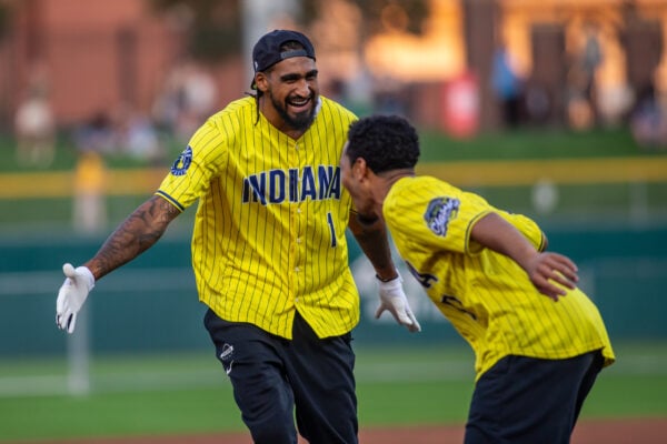 Indiana Pacers forward Obi Toppin smiles widely while celebrating a play with a teammate on the infield. (Photo/Josh Herd)