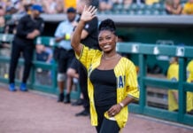 Recorder Rewind: Pacers Foundation Charity Softball Classic (Photos) Olympic gold medalist Simone Biles Owens smiles and waves to the fans from the sidelines at Victory Field. (Photo/Josh Herd)