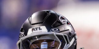 An Atlanta Falcons player smiles and flashes a diamond grill on the sidelines during the decisive 34-6 preseason victory over the Colts. (Photo/Walt Thomas)