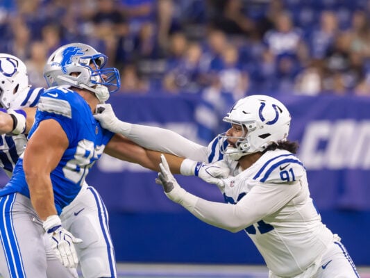An Indianapolis Colts defensive lineman locks arms and battles with an opposing Detroit Lions player on the line of scrimmage during the game on Aug. 29, 2026, at Lucas Oil Stadium, in downtown Indianapolis, Indiana. (Photo/Walt Thomas)