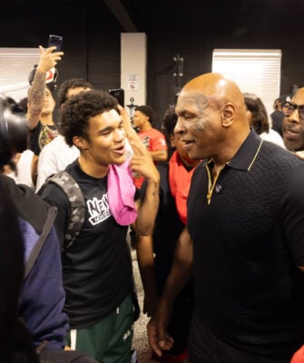 Mike Tyson speaks one-on-one with an attendee during a community youth workshop hosted in partnership with Mike Epps on Aug. 28, 2026, at The Right Jab boxing gym, located at 3737 Sutherland Ave, in Indianapolis. (Photo/Walt Thomas)
