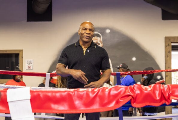 Mike Tyson stands in the ring addressing aspiring boxers and spectators during Mike Epps' community festival workshop on Aug. 28, 2026, at The Right Jab boxing gym, located at 3737 Sutherland Ave, in Indianapolis. (Photo/Walt Thomas)