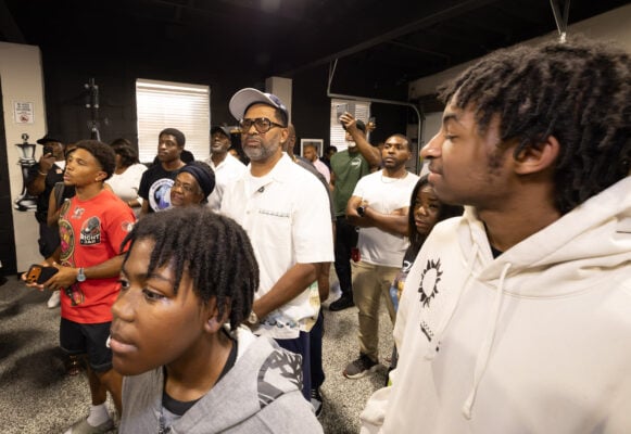 Indiana native, comedian and community activist Mike Epps (back left) listening alongside the youth to former heavyweight champion Mike Tyson, during a mentor session on Aug. 28, 2026, at Epps' boxing gym, The Right Jab, located at 3737 Sutherland Ave. in Indianapolis. (Photo/Walt Thomas)