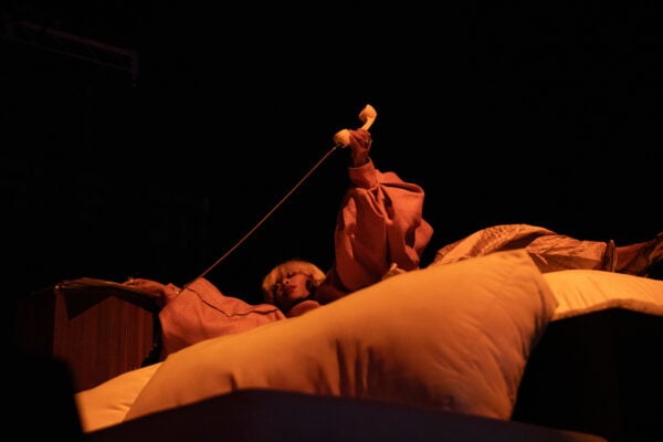 Grammy-winning artist Erykah Badu performs while lying on stage, singing into a vintage telephone receiver, on Sept. 22, 2026, at the Everwise Amphitheater at White River State Park, in Indianapolis, Indiana. (Photo/Mia Moore)
