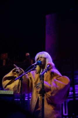 Erykah Badu gestures to the crowd while singing at the microphone stand on Sept. 22, 2026, at the Everwise Amphitheater at White River State Park, in Indianapolis, Indiana. (Photo/Mia Moore)