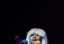 Photos: Erykah Badu concert at Everwise Amphitheater Erykah Badu looks out at the audience while performing her set on Sept. 22, 2026, at the Everwise Amphitheater at White River State Park, in Indianapolis, Indiana. (Photo/Mia Moore)