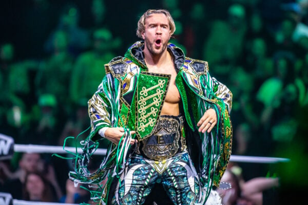Will Ospreay makes his grand entrance to the ring wearing his green and gold robe and the AEW International Championship on Sept. 23, 2026, at the Fishers Event Center, in Fishers, Ind. (Photo/Josh Herd)