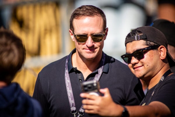 Former Purdue legendary quarterback Drew Brees takes a selfie with a fan on the sideline before the game on Sept. 26, 2026, at Ross-Ade Stadium, in West Lafayette, Ind. (Photo/Josh Herd)