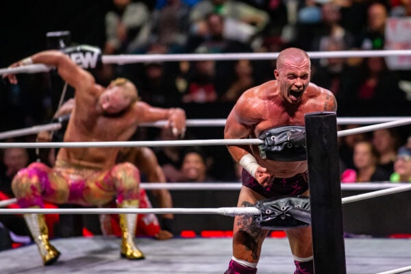 A competitor flexes and yells passionately in the ring while his tag team partner recovers in the background during AEW Dynamite on Sept. 23, 2026, at the Fishers Event Center, in Fishers, Indiana. (Photo/Josh Herd)