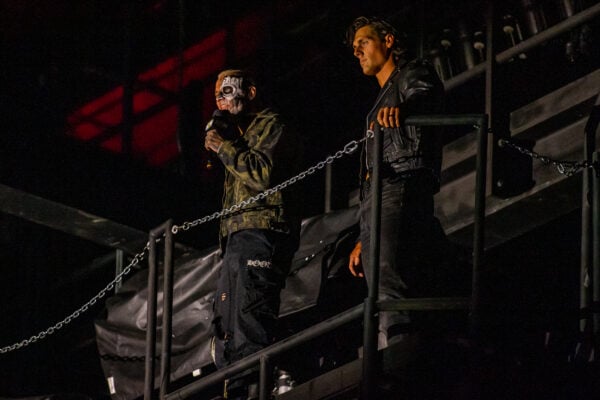 Darby Allin speaks into the microphone from a raised platform alongside a fellow wrestler during AEW Dynamite on Sept. 23, 2026, at the Fishers Event Center, in Fishers, Ind. (Photo/Josh Herd)