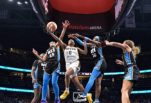 Undisputed: Kelsey Mitchell is your favorite’s favorite Indiana Fever guard Kelsey Mitchell (#0) splits the defense to attempt a contested layup mid-air. (Photo by Fabio Jardine / FirstPick)