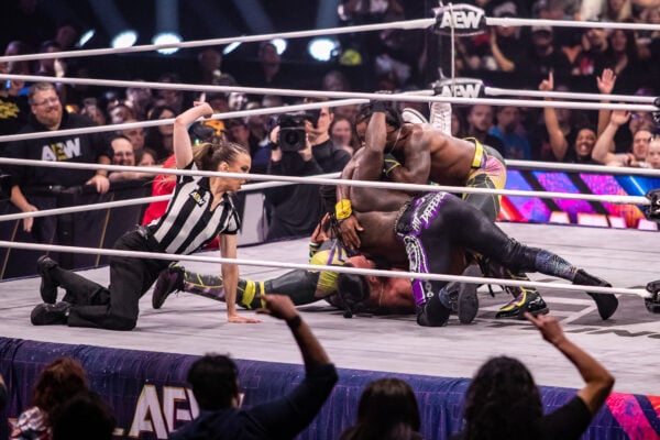 Referee Aubrey Edwards closely watches the mat as Swerve Strickland battles for control on the canvas during AEW Dynamite on Sept. 23, 2026, at the Fishers Event Center, in Fishers, Ind. (Photo/Josh Herd)