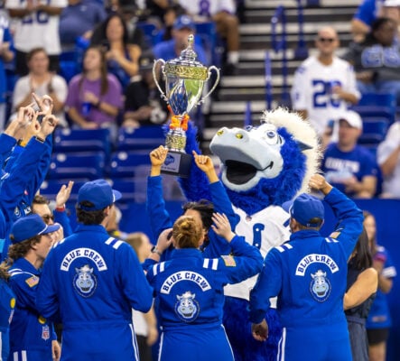 The Indianapolis Colts mascot, Blue, and members of the Blue Crew hoist the NFL Mascot of the Year trophy on Sept. 13, 2026, at Lucas Oil Stadium, in downtown Indianapolis, Indiana. (Photo/Walt Thomas)