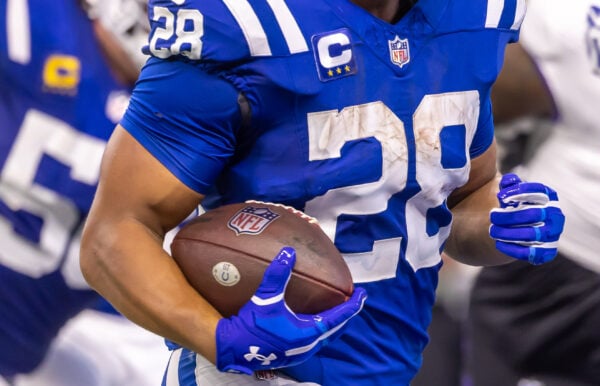 Indianapolis Colts running back Jonathan Taylor (#28) carries the football through the trenches on Sept. 13, 2026, at Lucas Oil Stadium, in downtown Indianapolis, Indiana. (Photo/Walt Thomas)