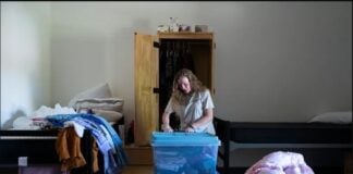 Valerie Lakes packs up her belongings to move to another room on Sept. 29, 2026, at Dove Recovery House for Women in Columbus. (Photo/ Cara Penquite/FPI News)